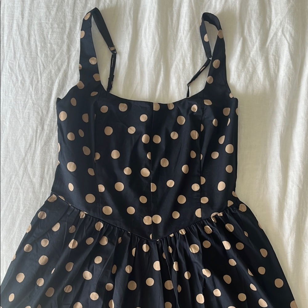 Black corset drop waist dress with gold polka dots